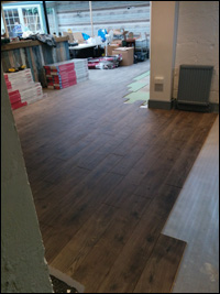 Fitting laminated flooring